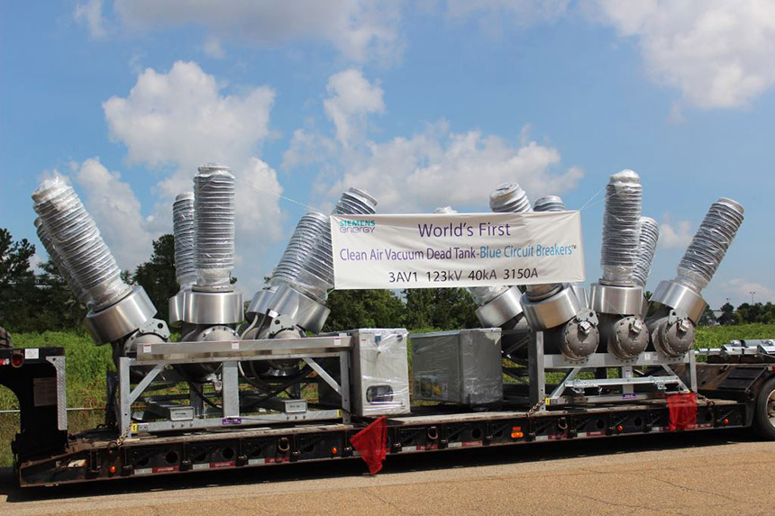 SF6 equipment consisting of several metallic cylinders protruding upward at an angle from a base